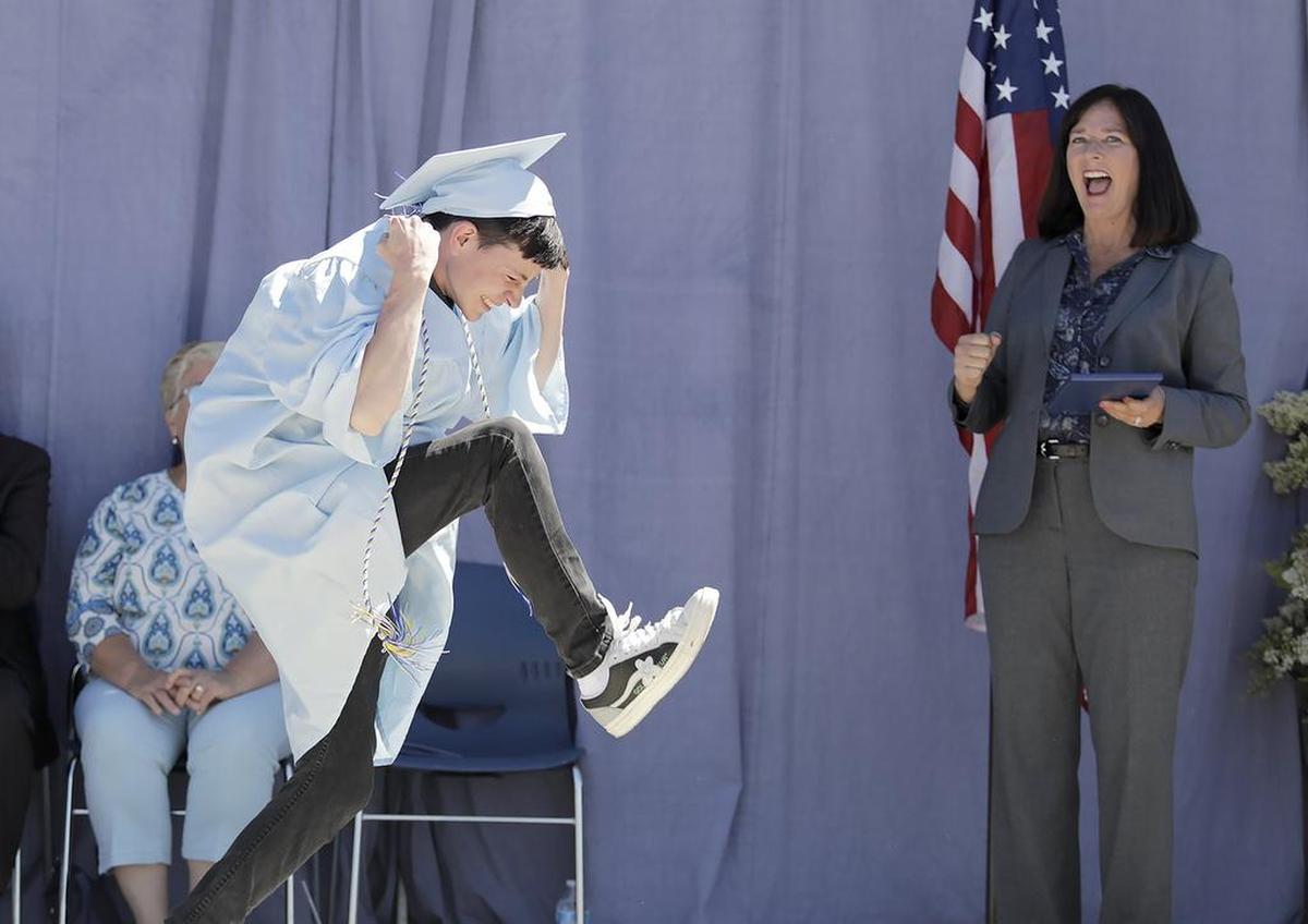 Central Coast New Tech High School presented its 63 seniors for graduation, Saturday, June 8, 2019 in Nipomo. Riley Witmer does a jig on stage en route to receiving his diploma from school principal Sarah Butler.