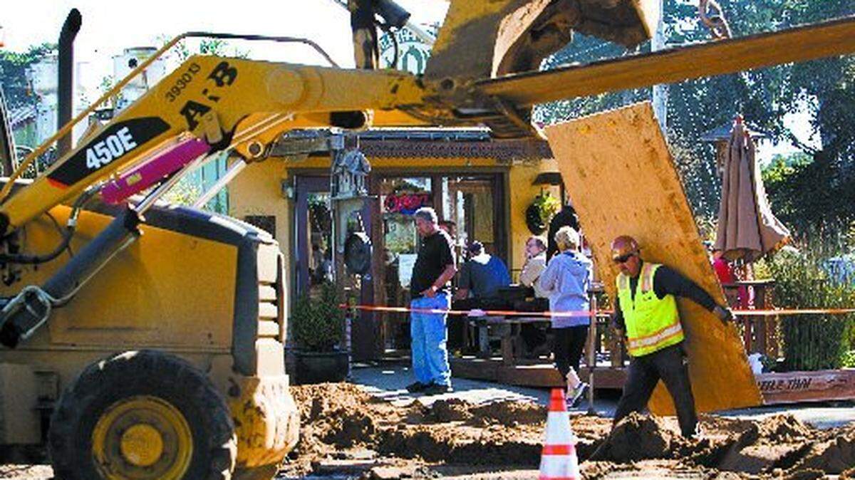 File photo of workers installing sewer lines in the Baywood neighborhood of Los Osos in January.