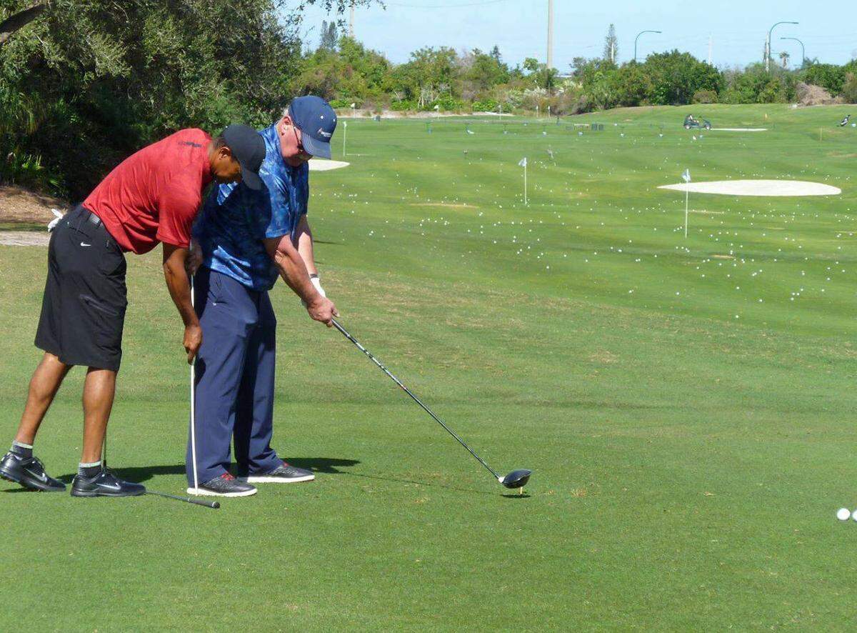 Tiger Woods gives Cambria resident Craig Cornell a private lesson at Medalist Club in Hobe Sound, Florida on Feb. 8.