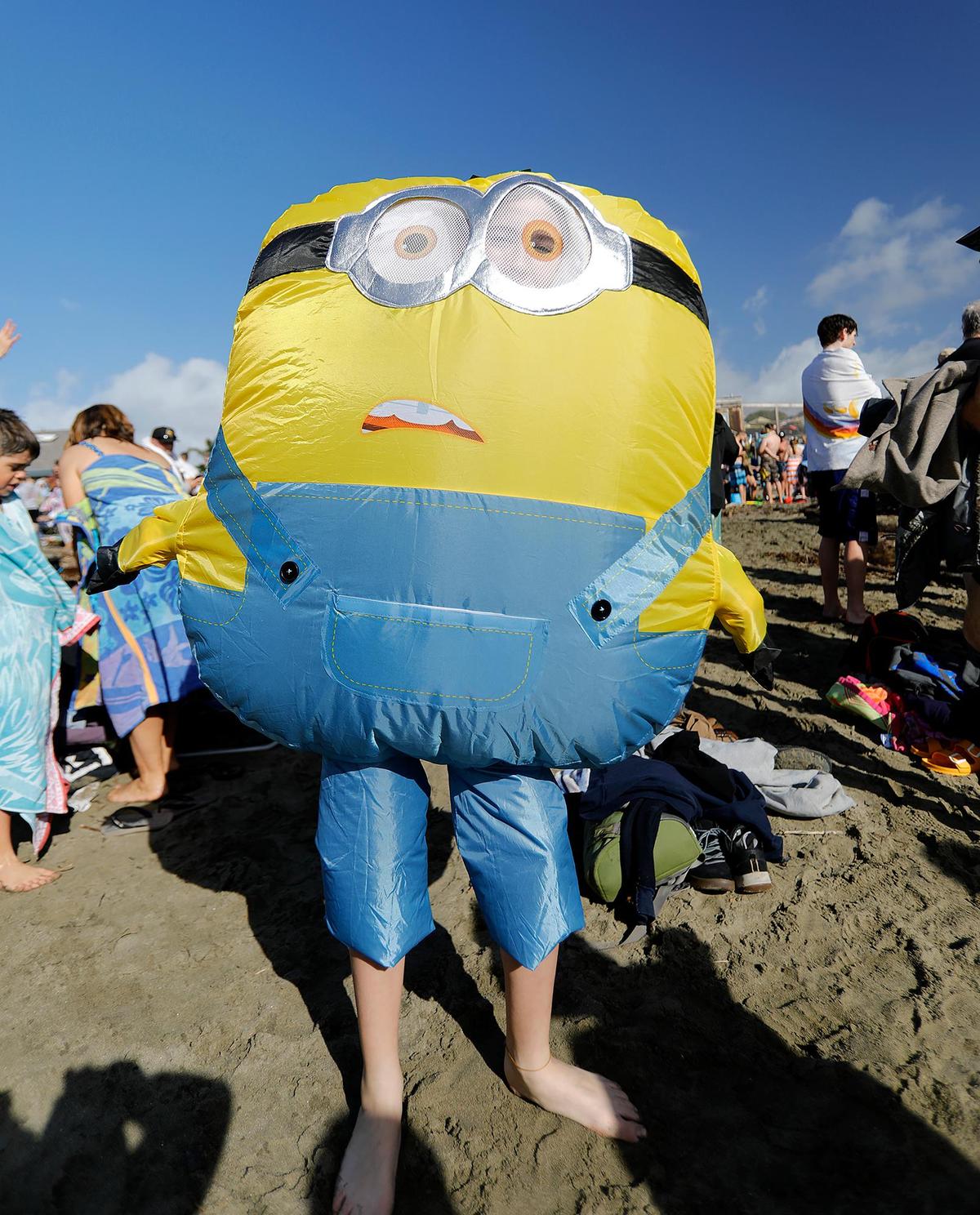 Tagen Avila, 12, from Riverdale is a minion. The 43rd Carlin Soule Memorial Polar Bear Dip invites community members to don swimsuits and silly costumes before welcoming the new year by running into the waves.