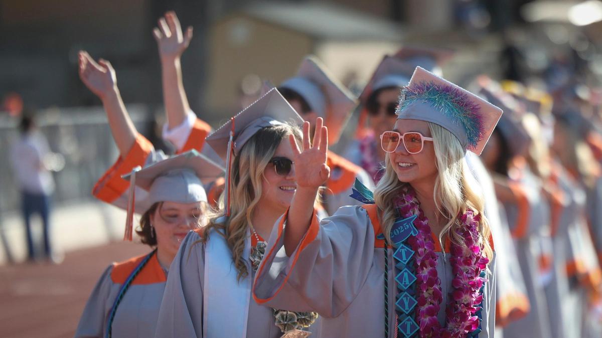 Taytem Ferrell waves to onlookers in the stands. Atascadero High School held commencement for 295 graduates on June 4, 2025.