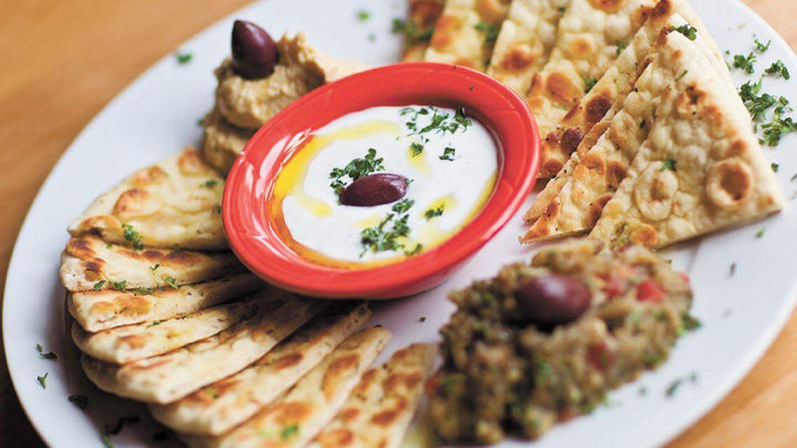 Pikalia - An assortment of Greek Dips, tzatziki, hummus, melitzanosalata(eggplant), served with grilled soft honey sweet bread. The WIld Donkey Cafe in SLO.  Photo by Jayson Mellom 05-18-11