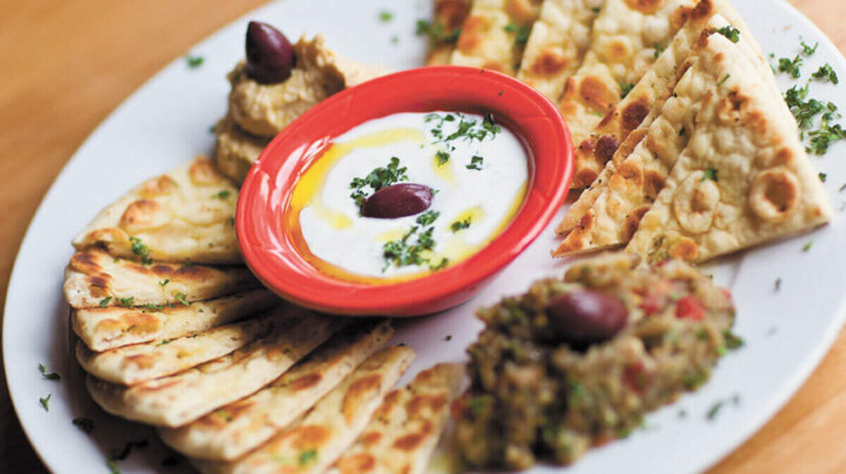 Pikalia - An assortment of Greek Dips, tzatziki, hummus, melitzanosalata(eggplant), served with grilled soft honey sweet bread. The WIld Donkey Cafe in SLO.  Photo by Jayson Mellom 05-18-11