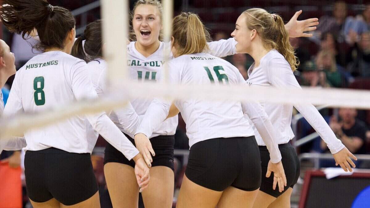 The Cal Poly volleyball team celebrates a point against the University of San Diego in a first-round game of the NCAA Tournament on Friday night at the Galen Center in Los Angeles.