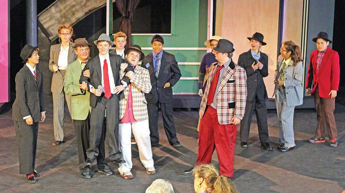 From left, Katrina Cleave, Cameron MacTavish, Carson Pierce, Jacob Wright, Ethan Walters, Treiy Petit, Brandon Loredo, Emily Dubnow, Nate Ehlers, Annika Marthaler, Michelle Campos and Cesar Hernandez play in ‘Guys and Dolls.’