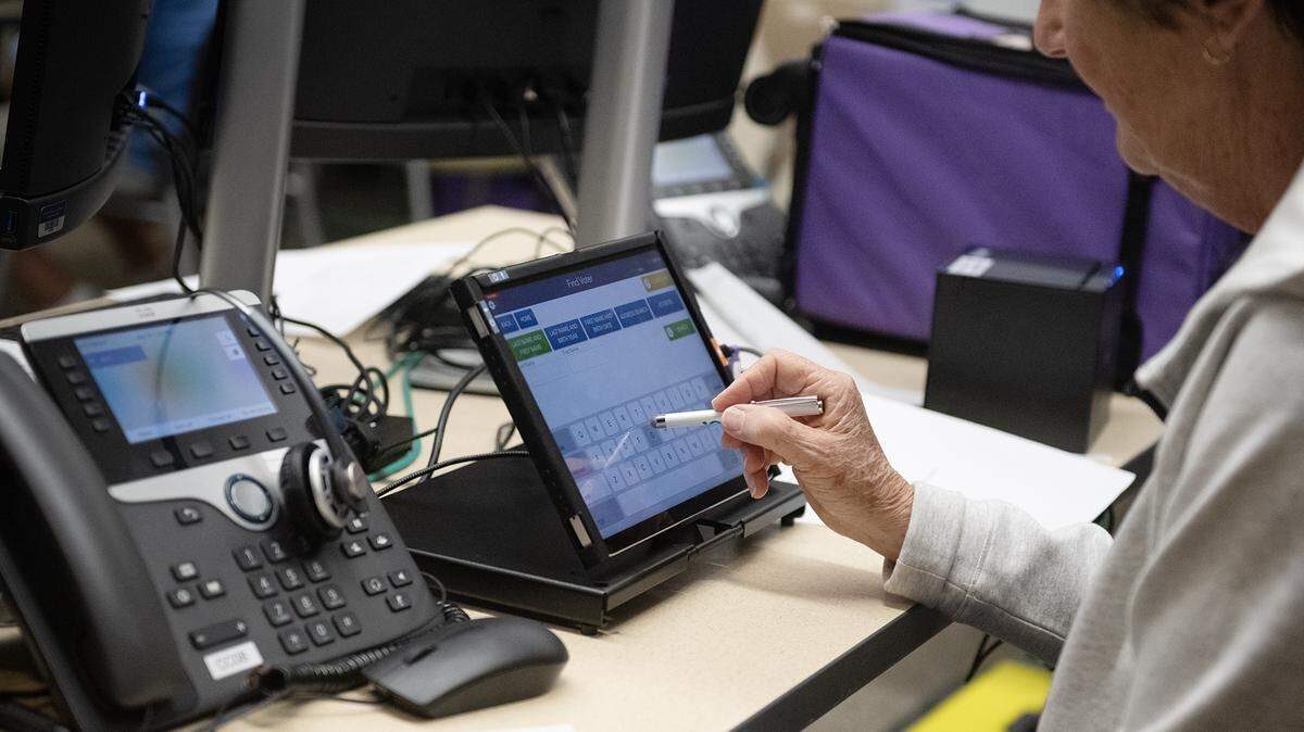 A pollworker-in-training practices using a new electronic pollbook that will be used at precincts on Election Day. Seen here on May 26, 2026.