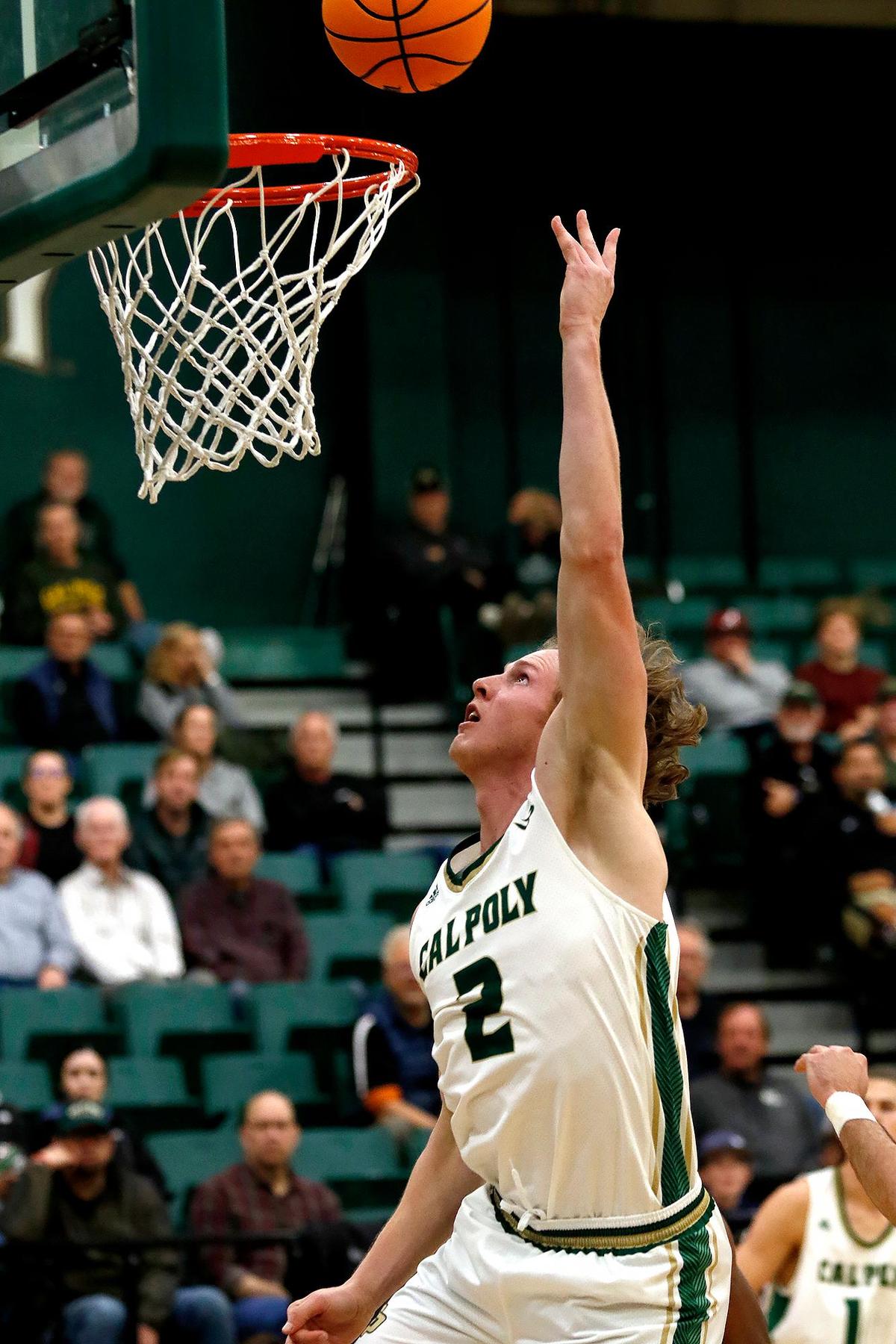 Cal Poly’s guard Mac Riniker makes a basket. Cal Poly Mustangs beat the Denver Pioneers 95-94 in overtime at Mott Athletic Center at Cal Poly’s San Luis Obispo campus, Tuesday, Dec. 17, 2024.