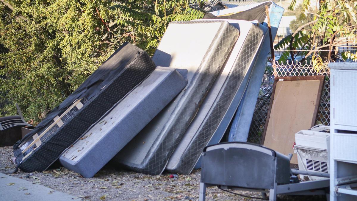 Residents have discarded mattresses and furniture behind the Grand View Apartments in Paso Robles because of the bedbug and cockroach infestation.