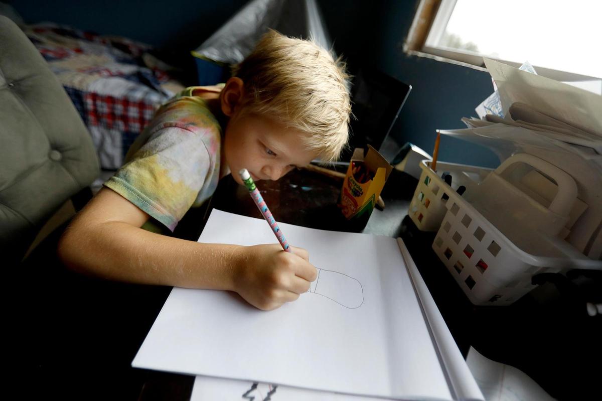 Nolan Keiper, 8, works on an art project while distance learning with the Atascadero Unified School District.