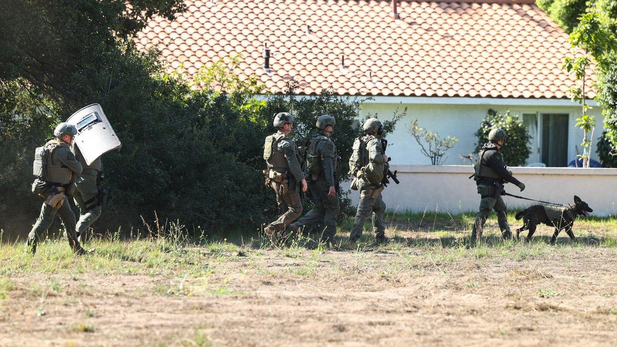Sheriff’s deputies leave their positions after a standoff that was sparked by an argument and gunfire in the Northview Avenue of the Nipomo Mesa on Sept. 18, 2023.