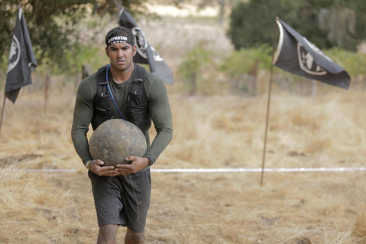 Anil Ratti of Reno competes in the stone carry at the Spartan race event held in Santa Margarita on Saturday, Nov. 2, 2024.
