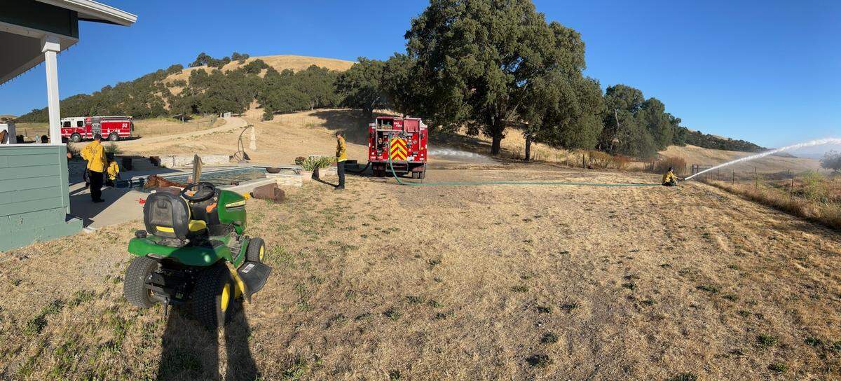 Firefighters respond to a scene of a horse stuck in a pool in rural San Miguel on June 15, 2024.&nbsp;