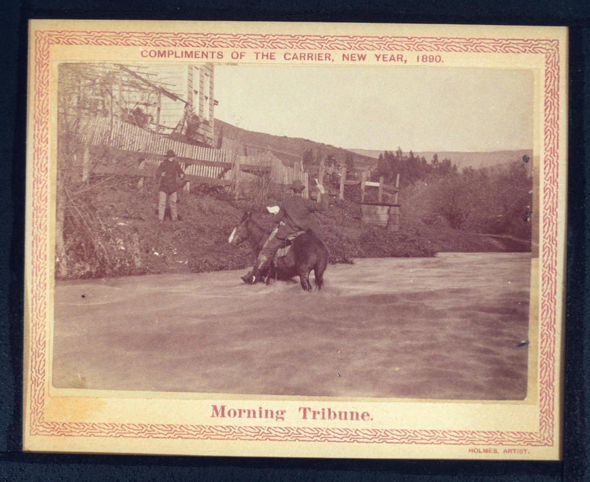 Notes from San Luis Obispo County History Center say Ed Carpenter is on horseback, here he poses as if throwing a newspaper to a subscriber on the bank. The Tribune gifted a series of photos to subscribers Jan. 1, 1890 of carriers delivering the paper. “Poly T-T Antique” 7-29-1994 copy negatives by Wayne Nicholls.