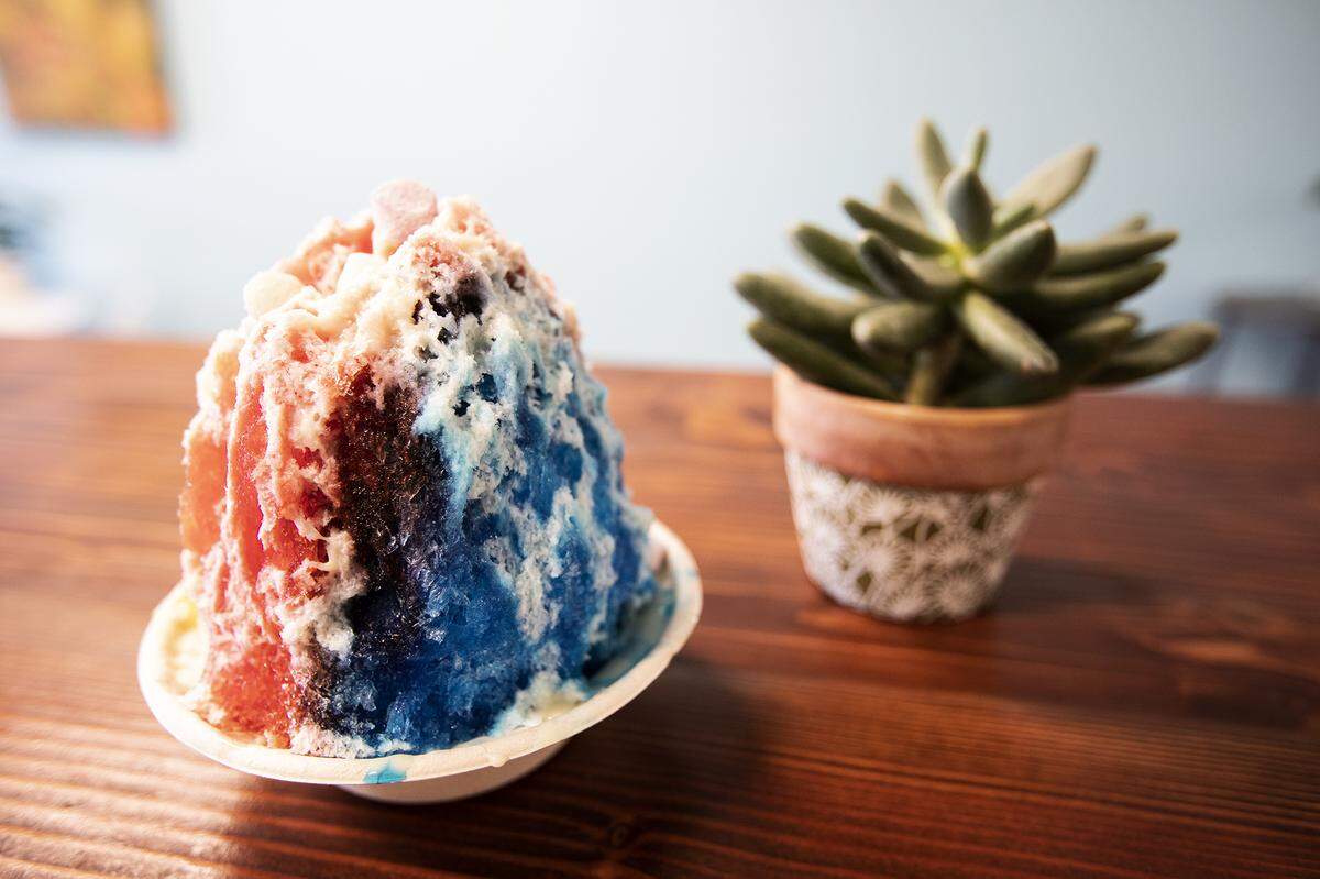 Hawaiian-style shave in three flavors — tiger’s blood, blue raspberry and pineapple — is topped with sweetened condensed milk and mochi balls at PCH Shave Ice & Boba in Pismo Beach.