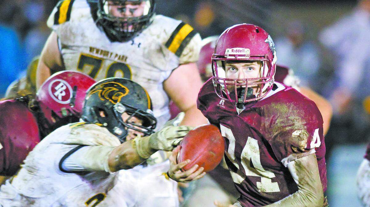 Paso Robles High’s Bailey Gaither (34) looks for running room in the Bearcats’ 13-10 win over Newbury Park in December in the CIF-Southern Section Northern Division championship game.