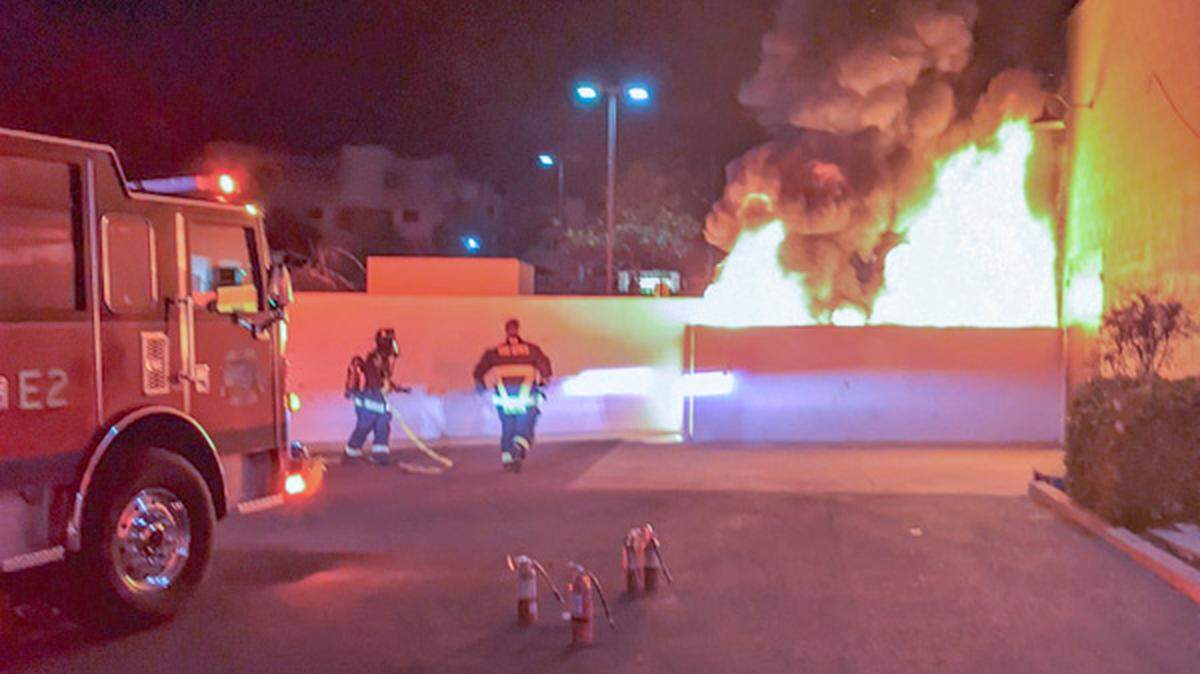 Grover Beach Police Department officers and the Five Cities Fire Authority respond to an apparent arson fire behind a Sherwin-Williams paint store on Feb. 12, 2022.