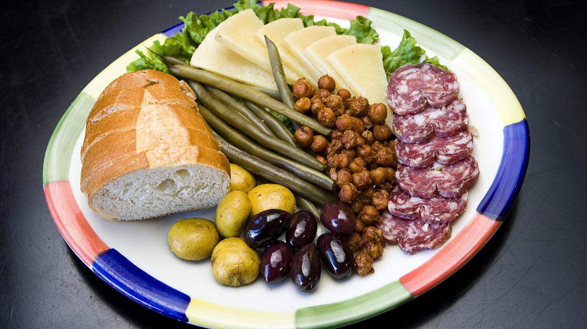Big Sky's antipasti plate with pickled Rutiz Farms green beans, Alle-Pia Barolo salami, Rinconada Dairy sheep’s milk cheese and Brian’s Bakery French bread.