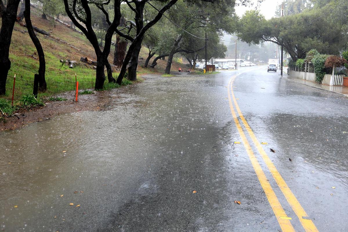 An area of Main Street is flooded in Cambria’s East Village. A strong storm hit the North Coast area with heavy rain and high winds on Wednesday, Jan. 27, 2021.
