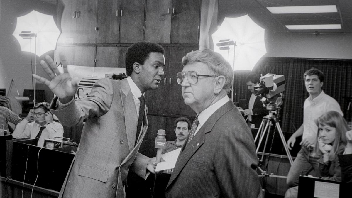 Reporters in the San Luis Obispo County Government Center on election night Nov. 4, 1986. A KSBY reporter at left prepares to interview Jim Johnson, in glasses, who was leading and would win election to San Luis Obispo County supervisor. At far right is Kelly Teel, now news production manager and chief photographer for the station.