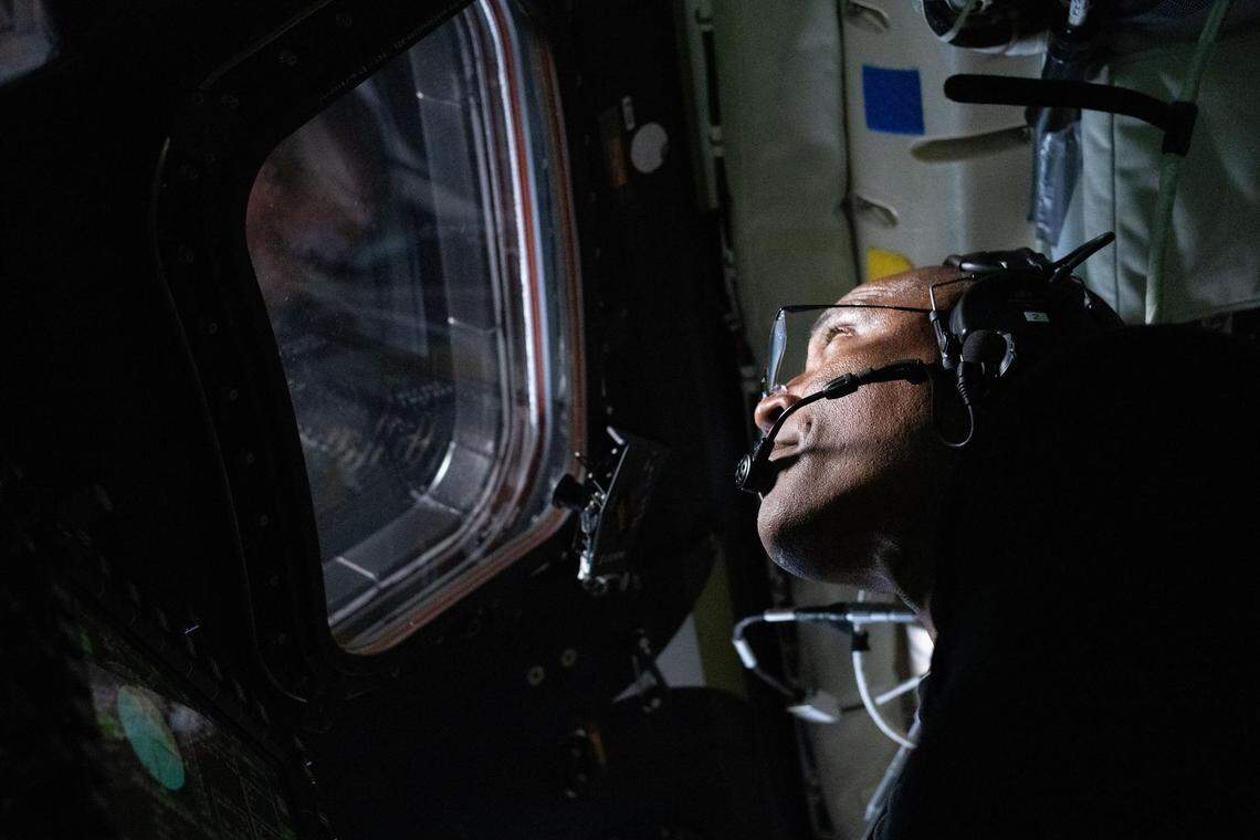 NASA astronaut and Artemis II Pilot Victor Glover pictured here in the Orion spacecraft during the Artemis II lunar flyby on April 6, 2026. Glover and his fellow crewmates spent approximately seven hours taking turns at the Orion windows capturing science data to share with their team back on Earth. At closest approach, they came within 4,067 miles of the moon’s surface.