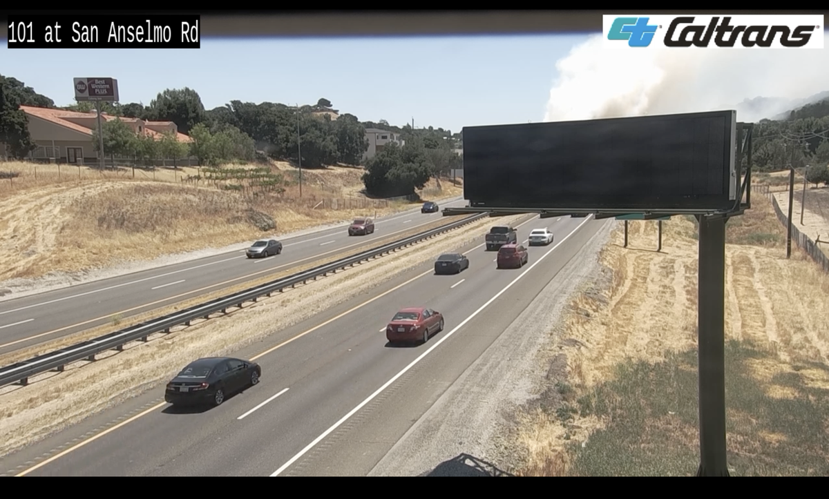 Traffic camera footage along Highway 101 at San Anselmo Road captured a smoke plume from the brush fire on July 15, 2023.