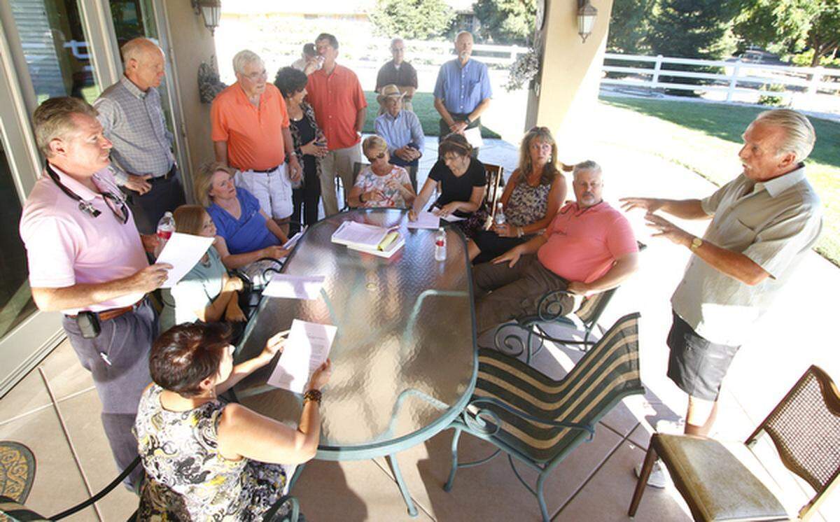 Murray Powell, right, speaks during a meeting of Templeton residents opposed to a proposed mental facility.