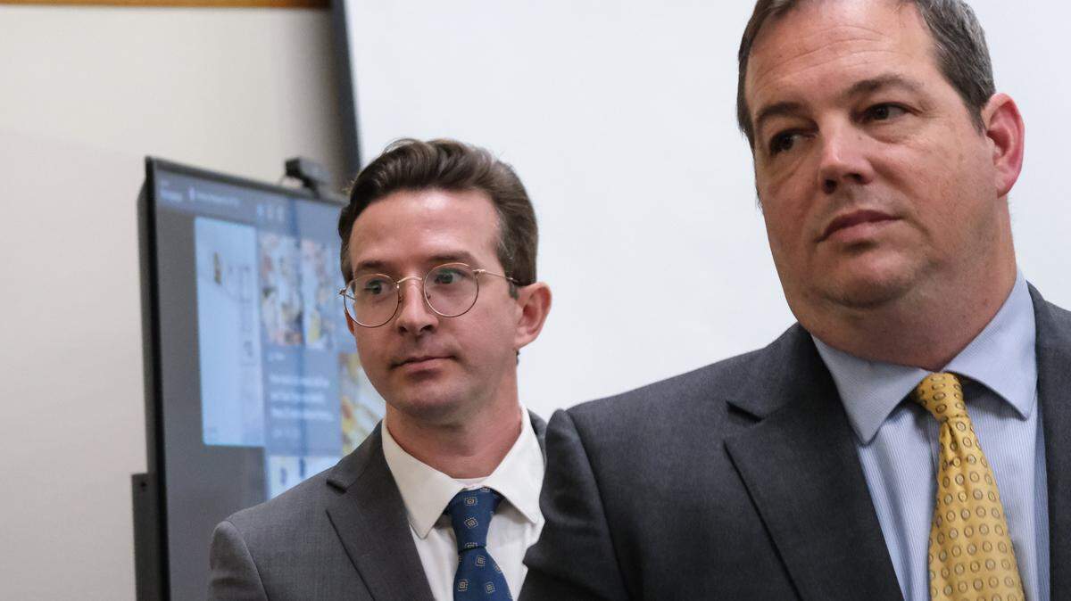 Nate Abate, left, stands with his attorney Scott Taylor during the trial against him in San Luis Obispo Superior Court on Oct. 15, 2024. Abate is charged with two counts of rape by force, one count of rape by intoxication and oral copulation of a minor — all felonies.