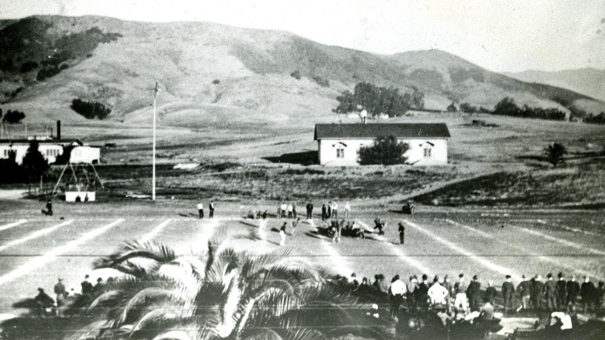 A 1917 Thanksgiving day football game at Cal Poly was preserved for posterity by this picture, which comes from the collection of Mrs. Zaidee Andrews of Atascadero. The rolling grasslands pictured in the background are now completely filled in with Cal Poly classrooms, dormitories, shops, parking lots and other requirements of the learn-by-doing college. In that era, the Cal Poly Mustangs competed against neighboring high schools.