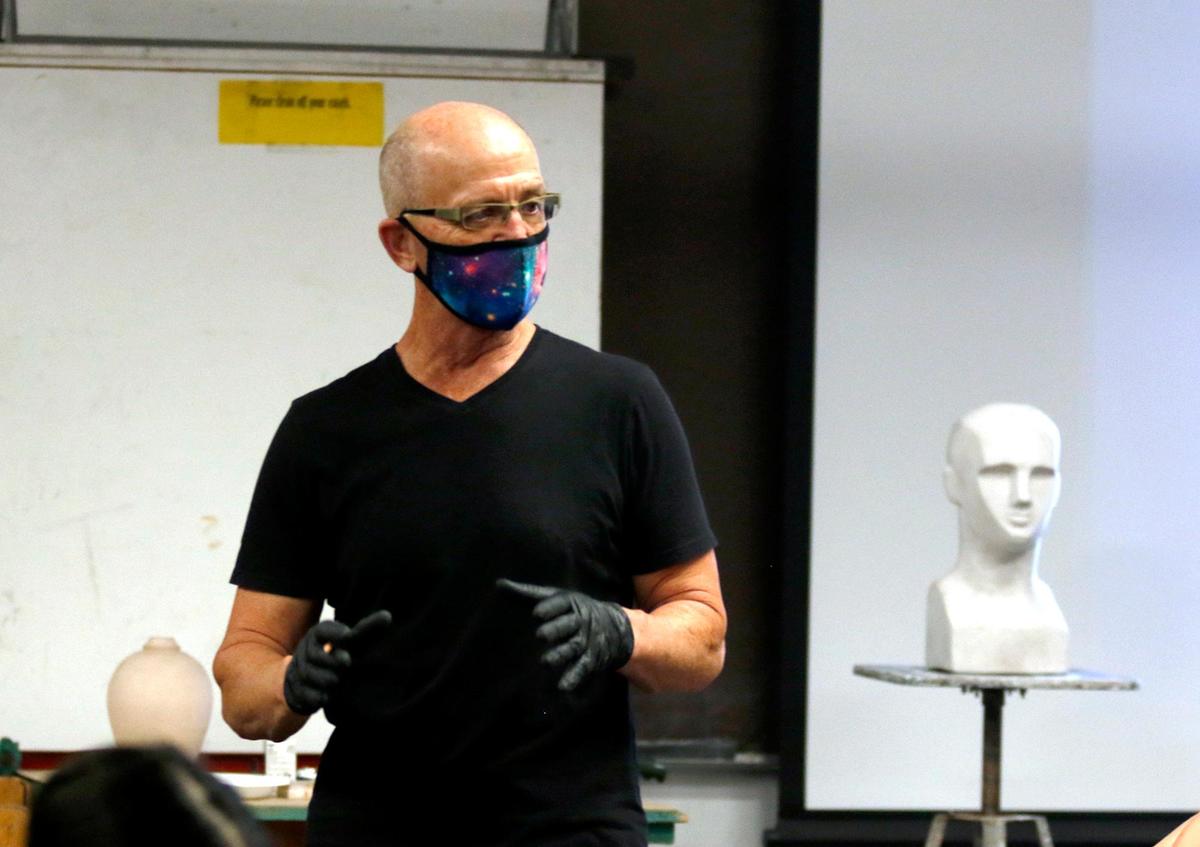 Cuesta College holds its first day of class for beginning art during the coronavirus pandemic. Art instructor David Prochaka speaks to students in his art class.