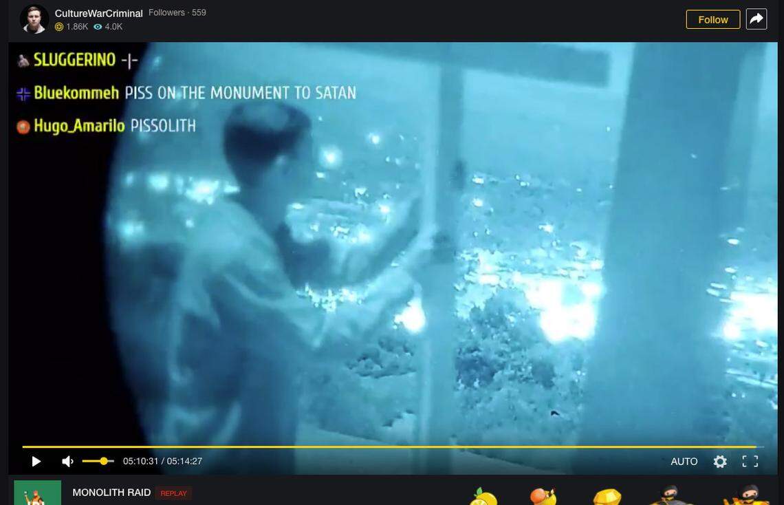 A group of young men drove from Southern California to Atascadero to topple the monolith on Pine Mountain early Thursday morning. Here, one holds the wooden cross they left in its place, while he looks out over the lights of the city.