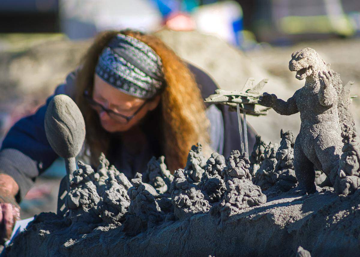 A drip sand sculpture featuring figurines like Godzilla was one of the top two entries in Cayucos’ Fourth of July sandcastle-building contest.