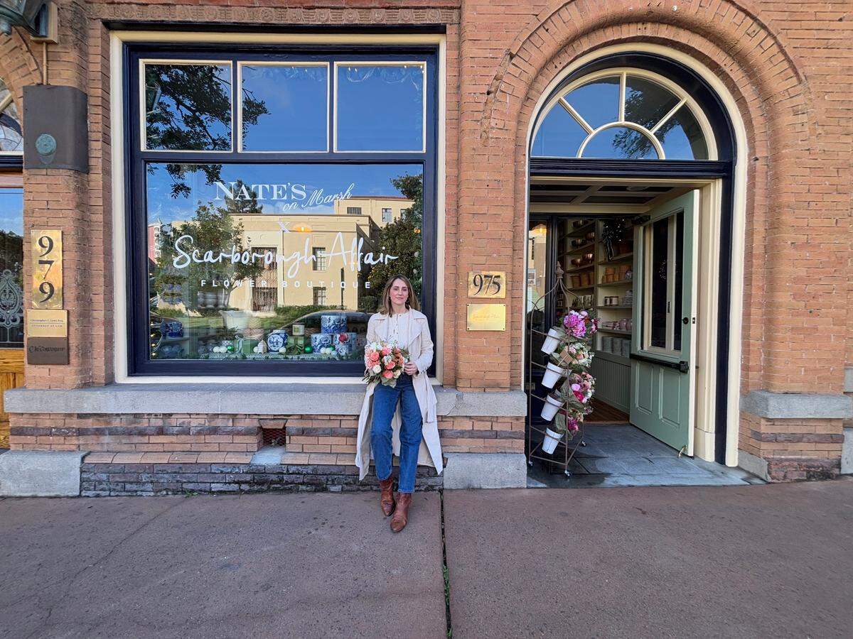 Laura Ellen stands outside her shop, Scarborough Affair, holding one of her bouquet creations in downtown San Luis Obispo.