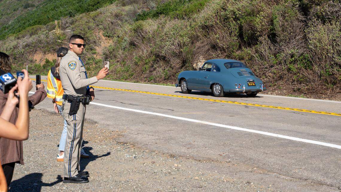 One of the first drivers to pass through Highway 1 at the site of Regent's Slide heads north on Highway 1 on Wednesday, Jan. 14, 2026. Wednesday, Jan. 14, 2026. Highway 1 was closed for three years due to a pair of large landslides starting in January 2023.