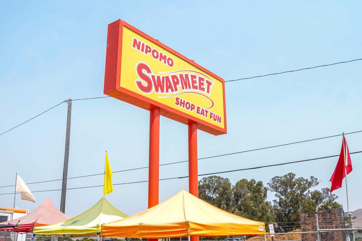 The Nipomo Swap Meet sign stands off of Highway 101 on Sunday, Aug. 10, 2025. The Swap Meet features more than 300 vendors, the largest market of its kind on the Central Coast.