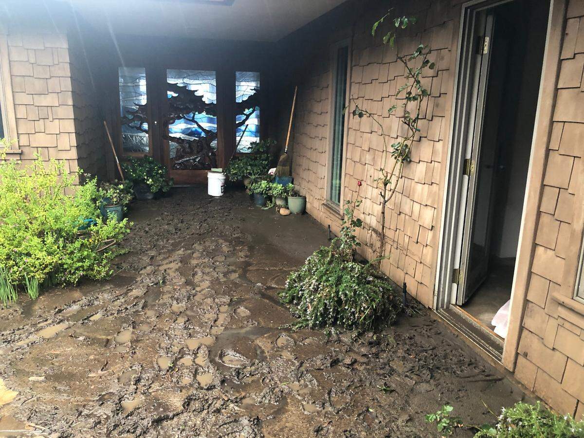 Floodwaters left a muddy mess at Diane Tappey’s home on Sherwood Drive in Cambria on Thursday.