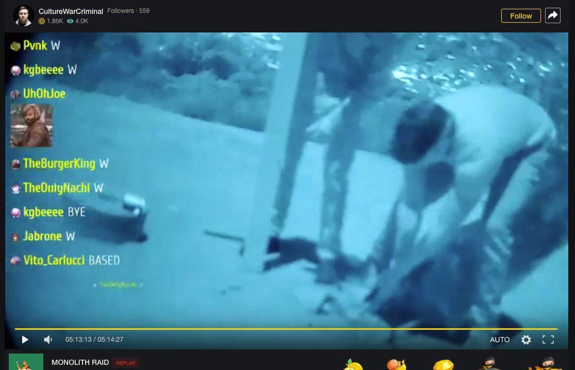 One of the men tries to remove the monolith from its base while another stands nearby holding the cross they left in its place. The group of men drove from Southern California to Atascadero to topple the monolith on Pine Mountain.