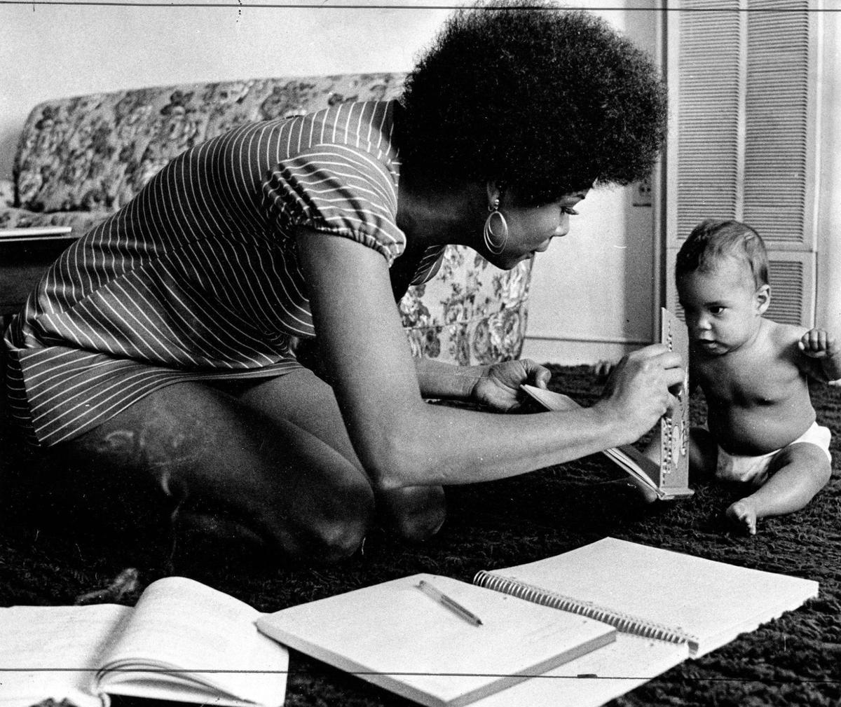 Dianne Anderson, 26, had gone back to school to become a registered nurse. She cares for daughter Lhia Yolanda, 7-months. A series of stories documented the lives of people on housing assistance published in the Telegram-Tribune in early 1970.
