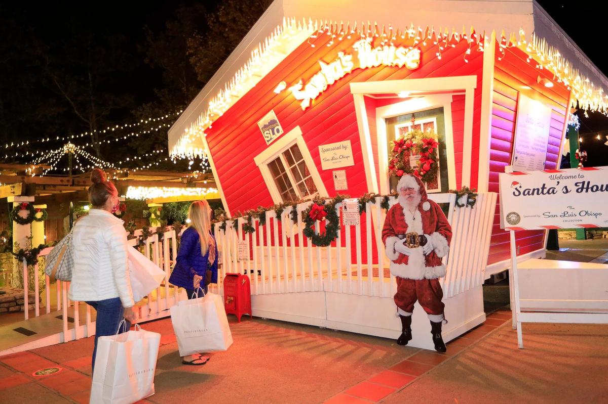 Shoppers stop at Santa’s House in Mission Plaza in downtown San Luis Obispo in 2020.