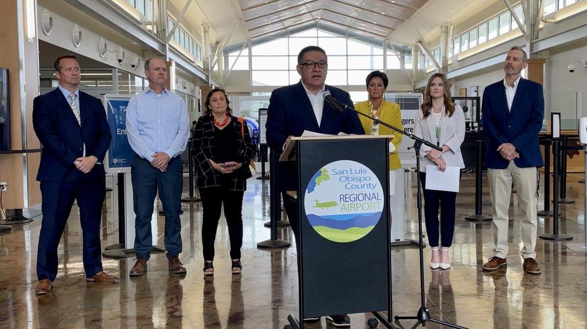 Congressman Salud Carbajal, center, speaks at the San Luis Obispo County Regional Airport on Wednesday, Sept. 6, 2023, about two new bills he was set to introduce into the House of Representatives about combating PFAS pollution at airports.