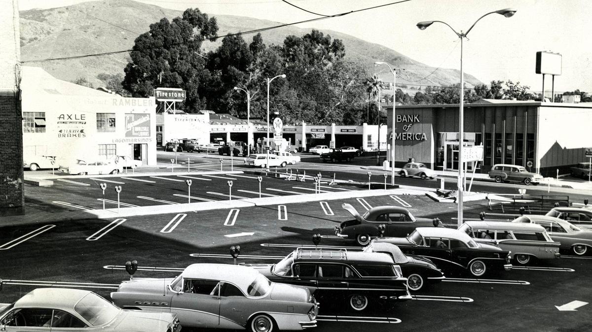 The Court Street parking lot between Monterey and Higuera Streets has now become a shopping center but in 1962 it was a newly paved lot where one could see the corner of the Obispo Theater at left and the Firestone garage and Bank of America building.