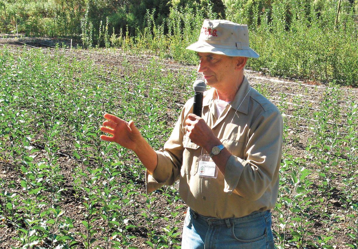 Dr. John DeVincenzo speaks to the members of the California Rare Fruit Growers in his apple seedling nursery in October 2007.