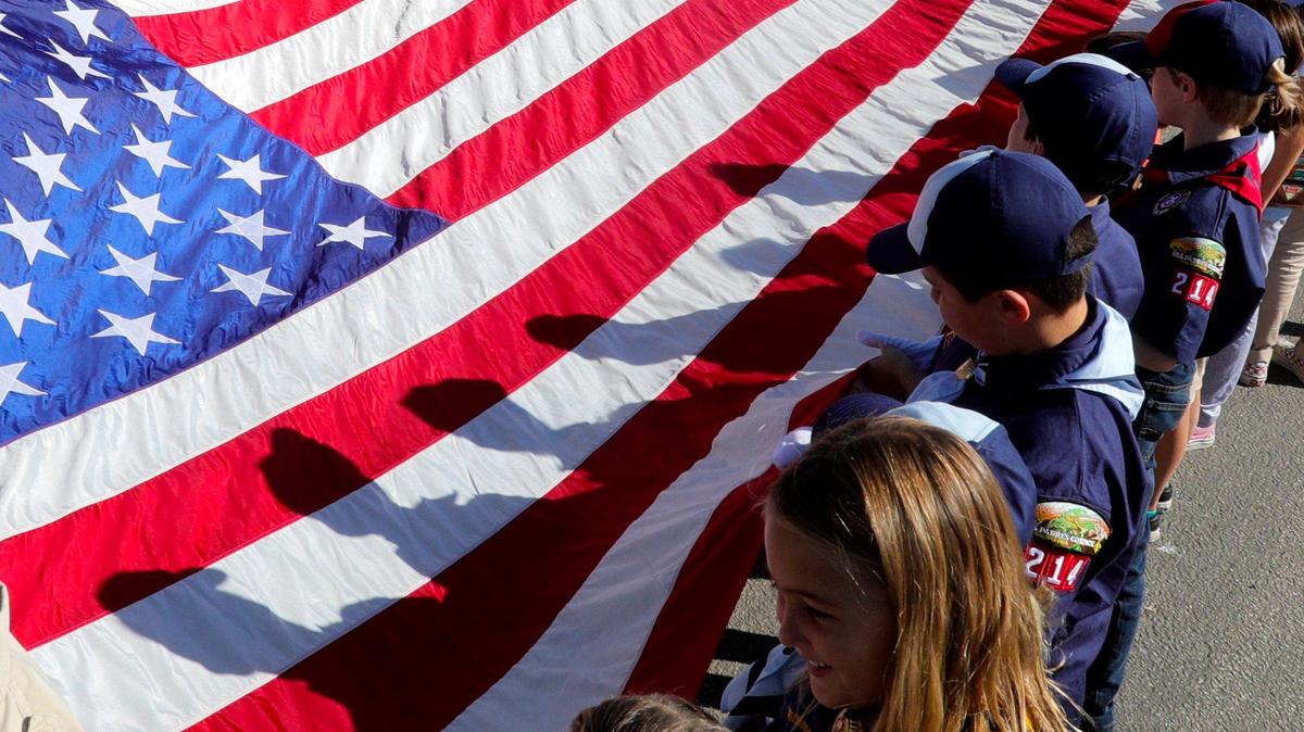Various scouting organizations carried a large American flag during a Veterans Day ceremony at Los Osos Valley Mortuary and Memorial Park on Monday. Veteran’s Day was observed throughout San Luis Obispo County.