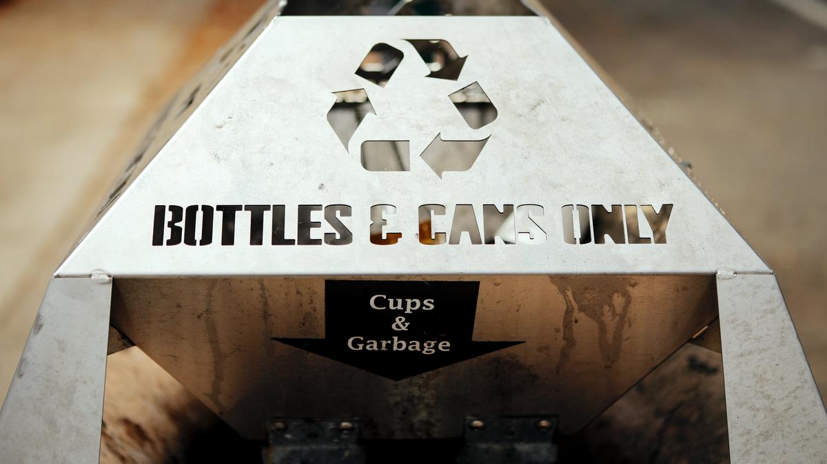 A recycling basket sits atop a trash can in downtown San Luis Obispo. Photo by Joe Johnston 07-30-18