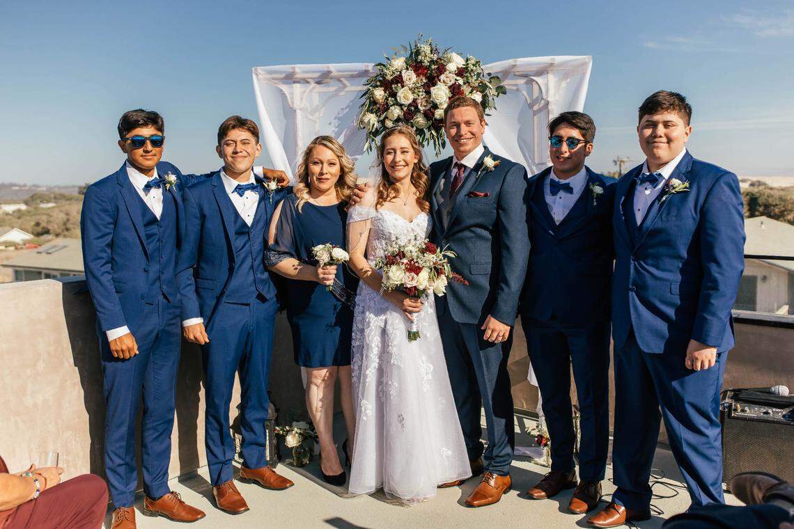 Shiloh Delgadillo, far left, celebrates the wedding of his sister Alondra Banks.