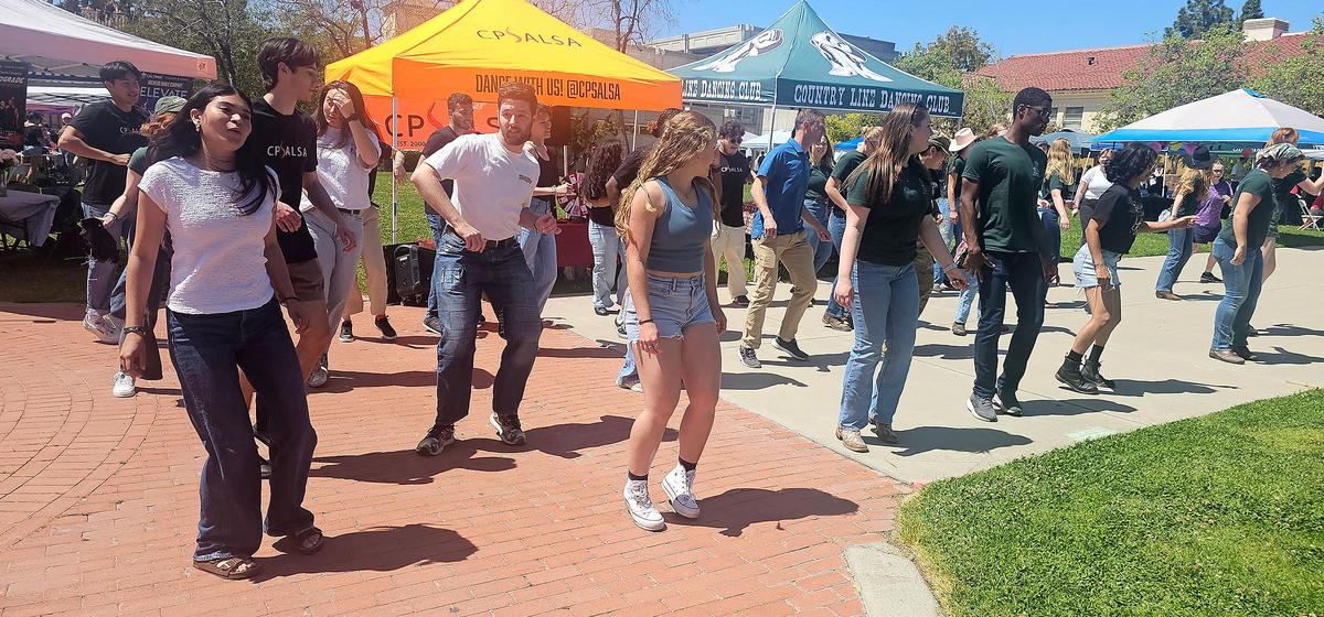 Cal Poly’s CPSALSA Club and the Country Line Dancing Club joined forces for a line dance. The song danced to was Payaso del Rodeo.