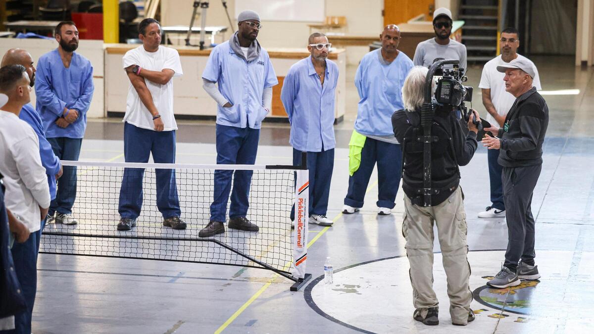 Pickleball coach Roger BelAir visited the California Men’s Colony in San Luis Obispo on Nov. 12, 2024, to teach the game to inmates. Hollywood filmmaker Daniel Ostroff was producing the documentary “Pickleball in Prison,” and a film crew was recording how the sport can break down barriers and provide positive interactions between inmates and staff.