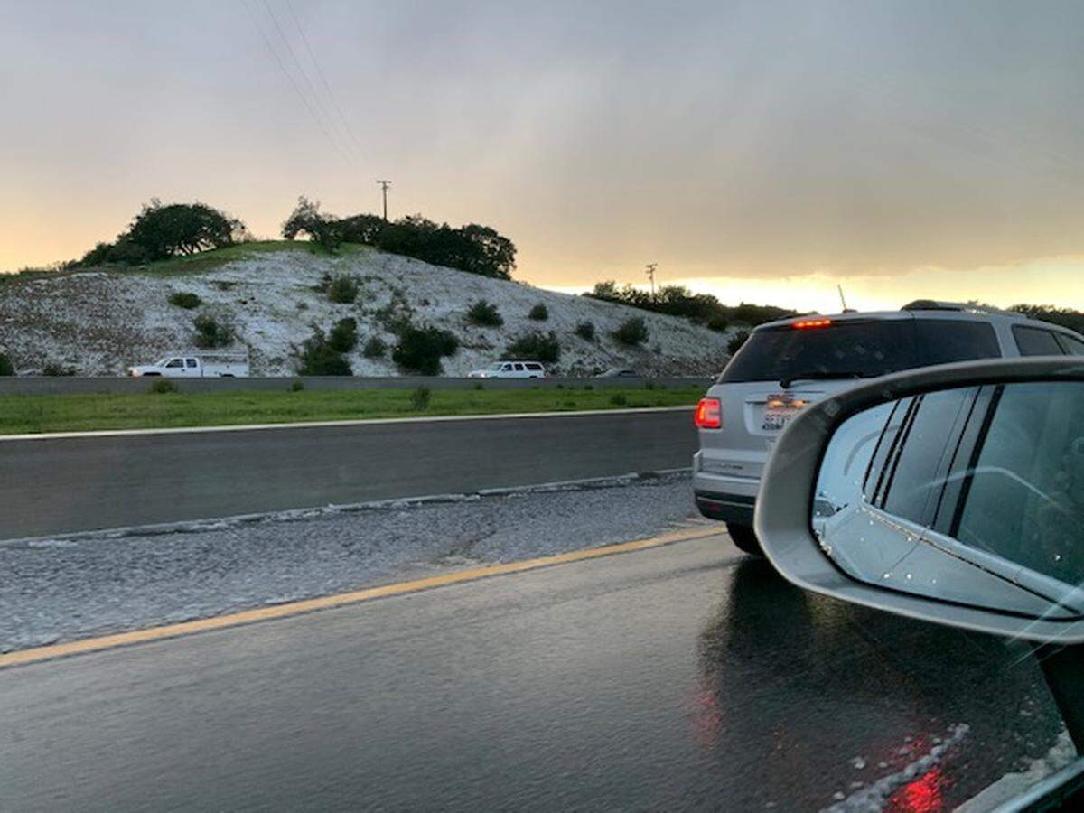 Hail covers a hillside off Highway 101 between Oceano and Nipomo.