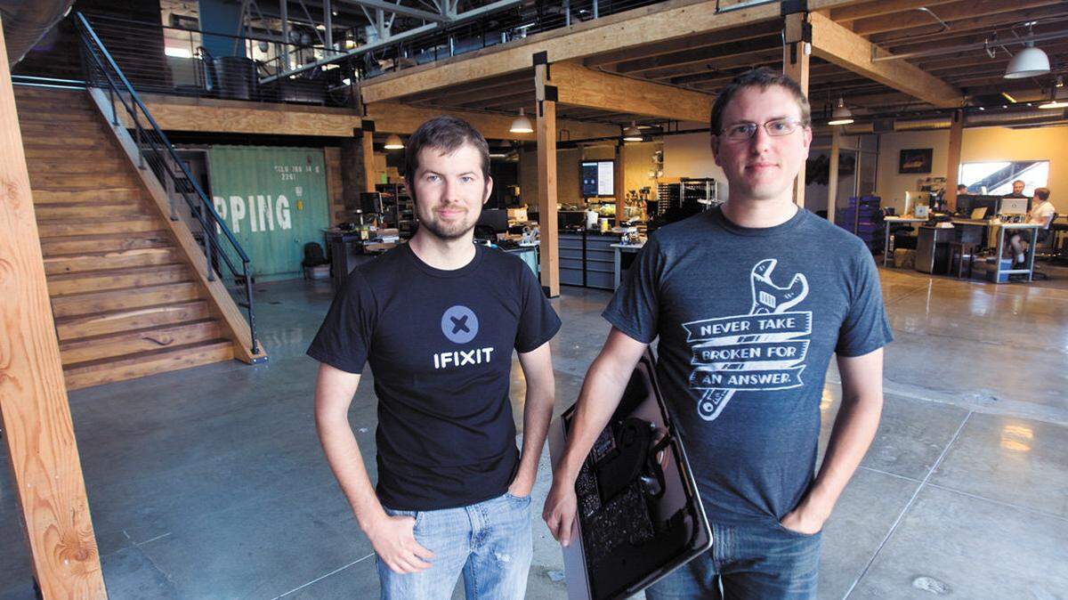 Luke Soules, left, and Kyle Wiens, co-owners of iFixit, pose in their newly remodled building on Monterey Street in San Luis Obispo.