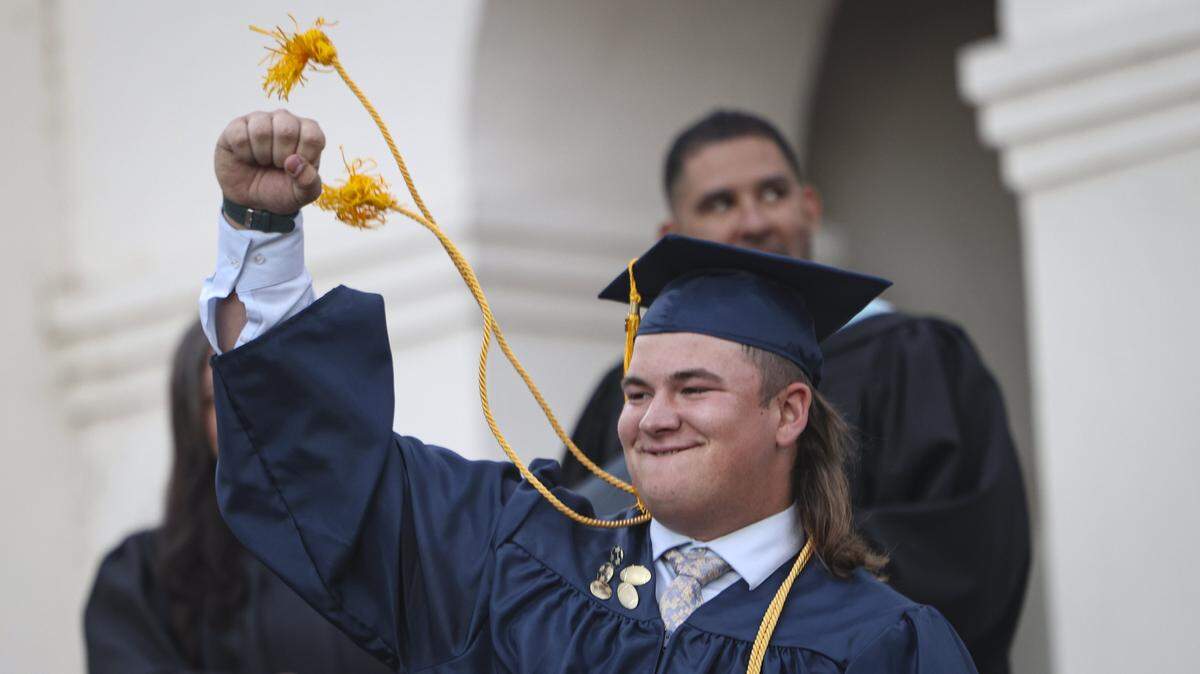 Aaron Bower celebrates with a fist pump after picking up his diploma. Mission Prep graduated 66 students in a ceremony at Old Mission San Luis Obispo on May 29, 2026.