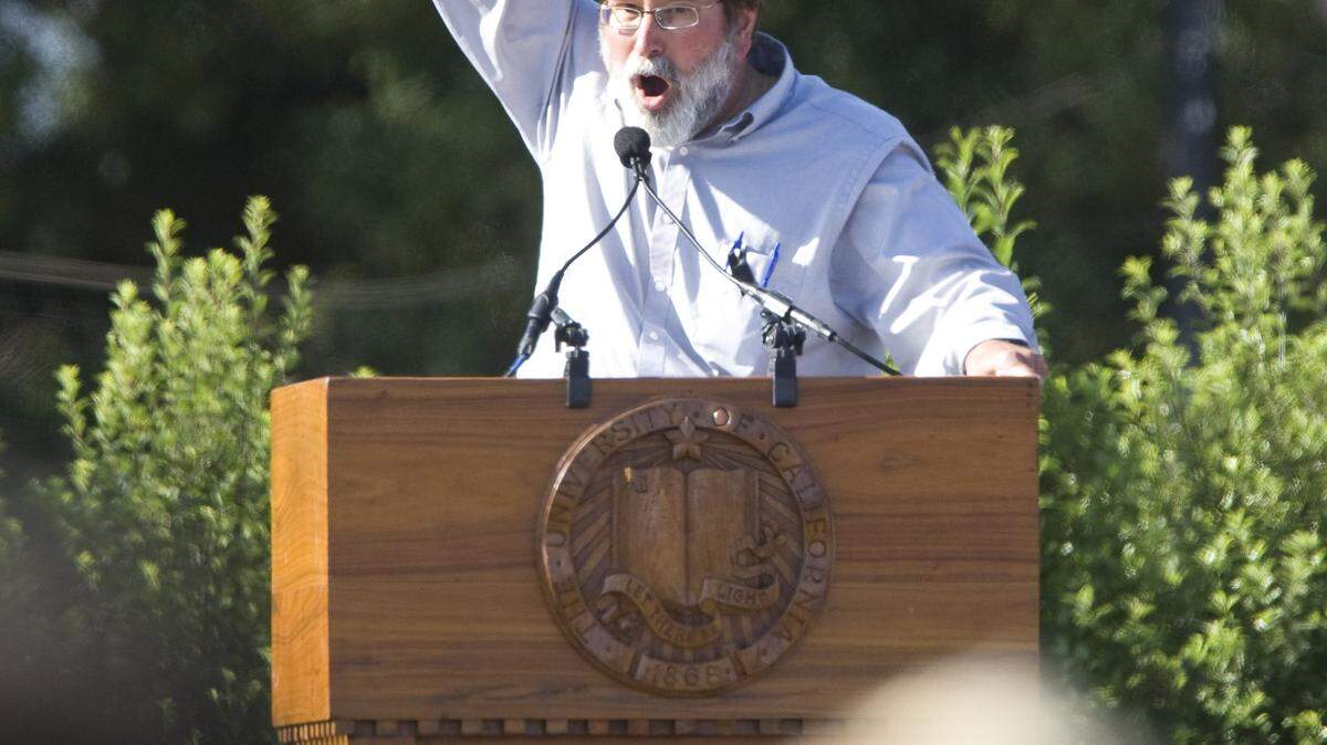 Richard Martinez asks the crowd to shout "Not one more" at a memorial service Tuesday, May 27, 2014, at UC Santa Barbara. His son, Christopher Michaels-Martinez, was one of six students killed during the Isla Vista rampage.
